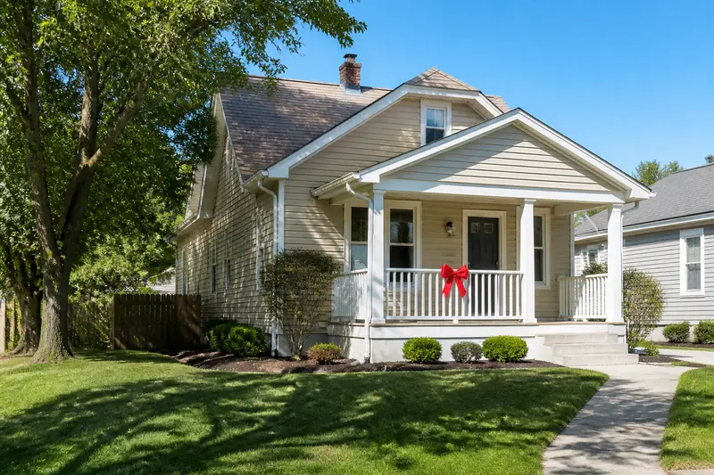 Woman handing over house keys at closing